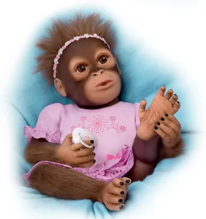 The Ashton-Drake Galleries Cooing Cora Vinyl Monkey Baby Doll, Touch Activated with Breathing Motion & Magnetic Pacifier Featuring Hand-Applied Mohair, 18 Inches (Brown, Pink)