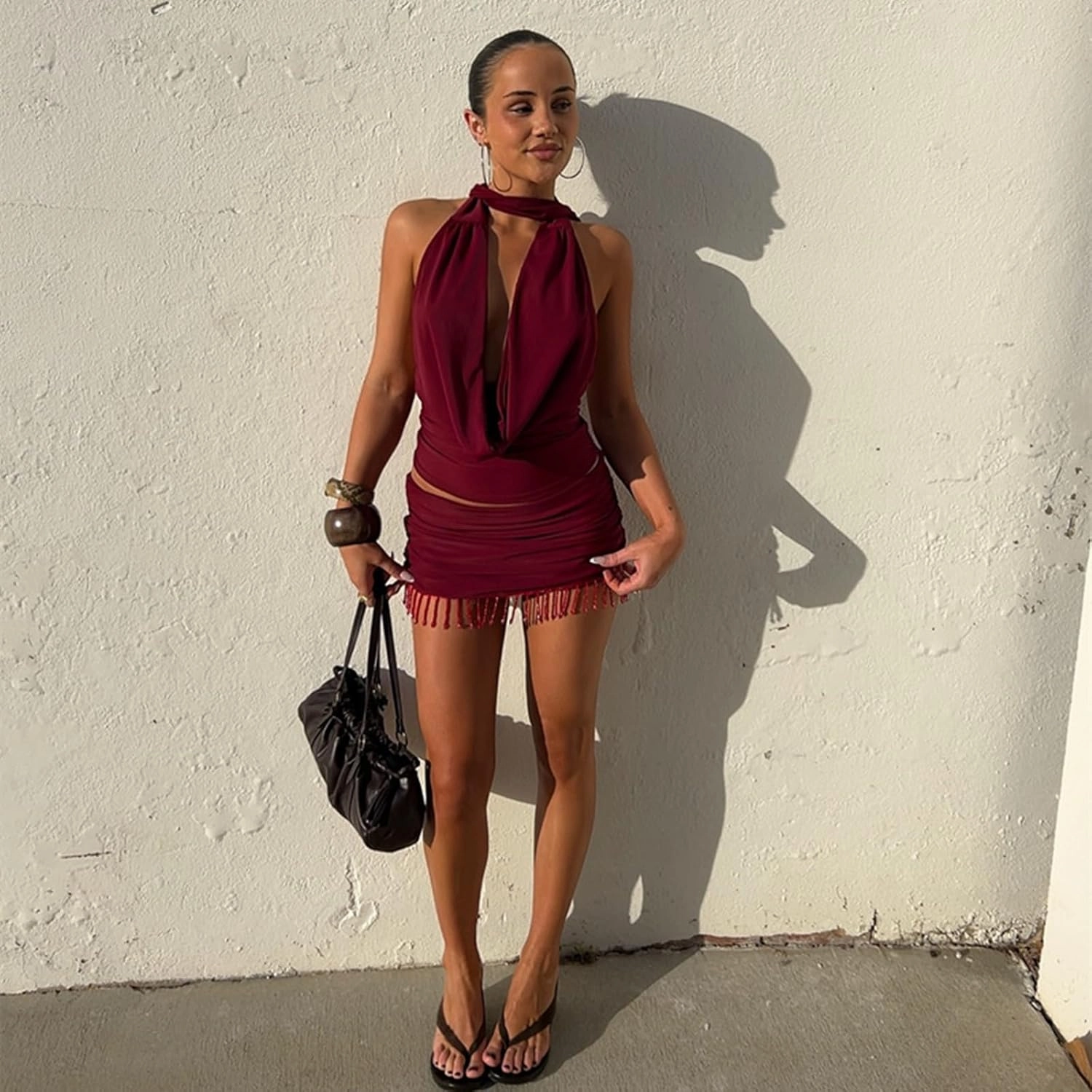 Wuitrie 2025 Women 2 Piece Outfits Backless Halter Cowl Neck Tucked Top Mini Tassel Bodycon Skirt Solid Elegant Sets Red
