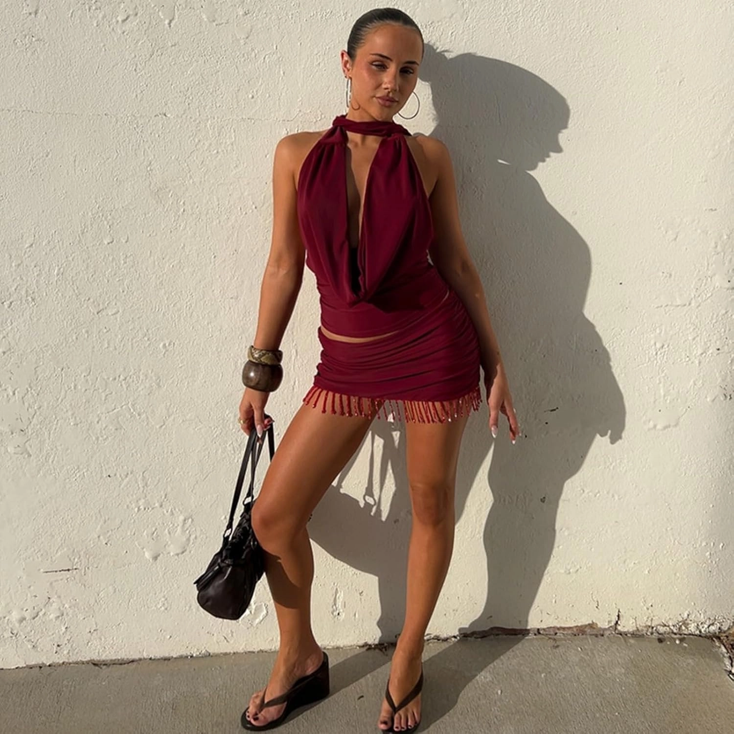 Wuitrie 2025 Women 2 Piece Outfits Backless Halter Cowl Neck Tucked Top Mini Tassel Bodycon Skirt Solid Elegant Sets Red