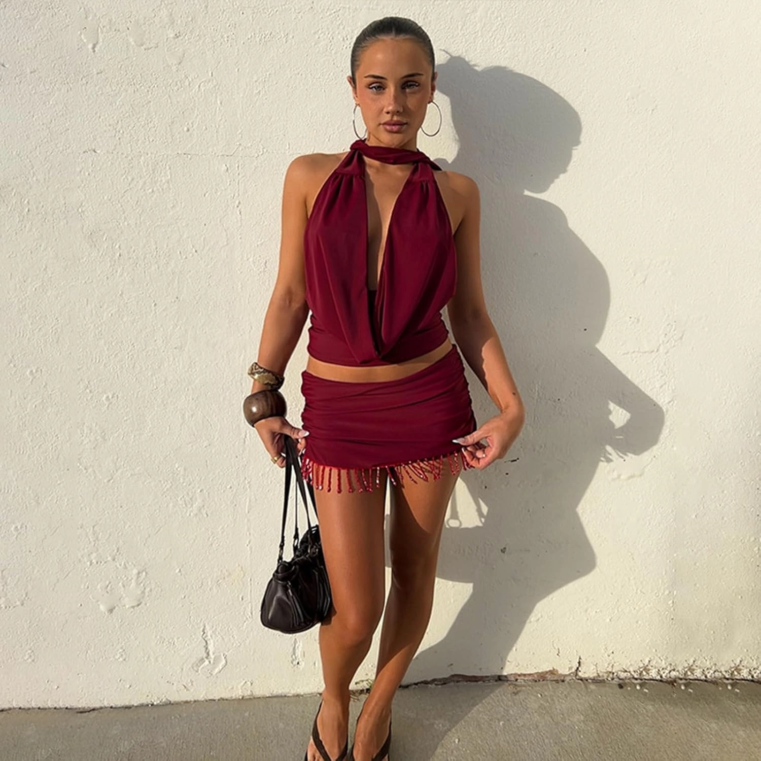Wuitrie 2025 Women 2 Piece Outfits Backless Halter Cowl Neck Tucked Top Mini Tassel Bodycon Skirt Solid Elegant Sets Red